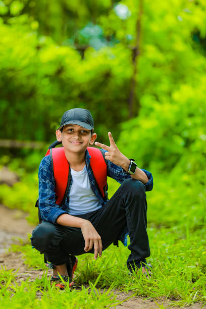 istock Indian cute schoolboy with backpack, Back to school concept 1284500047