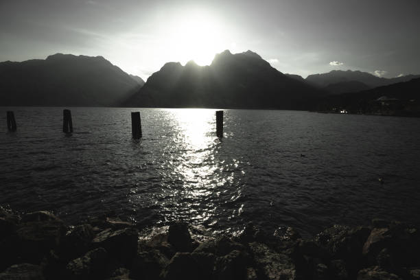 istock Lago di Garda and Alps peaks sunset black and white view 1284501941