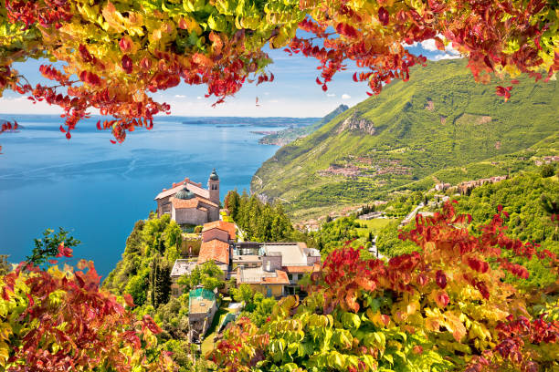 istock Madonna di Montecastello hermitage above Lago di Garda autumn foilage view 1284502096