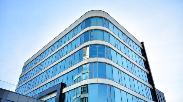istock Abstract texture and blue glass facade in modern office building. 1284507019