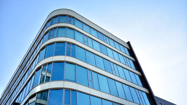 istock Abstract texture and blue glass facade in modern office building. 1284507024