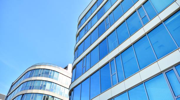 istock Abstract texture and blue glass facade in modern office building. 1284507033