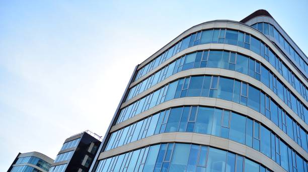 istock Abstract texture and blue glass facade in modern office building. 1284507039