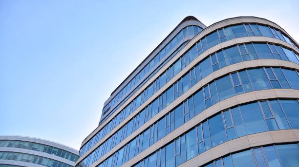 istock Abstract texture and blue glass facade in modern office building. 1284507559