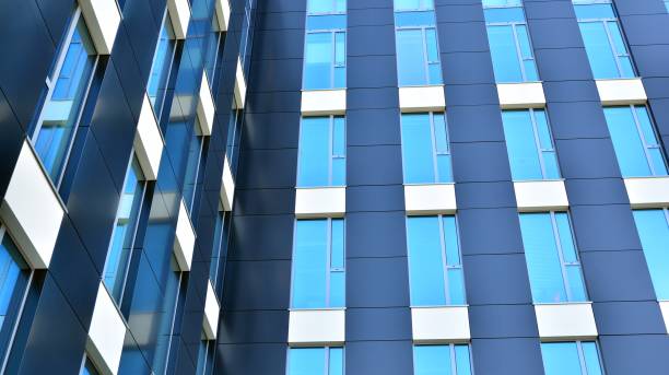 istock Abstract texture and blue glass facade in modern office building. 1284507615