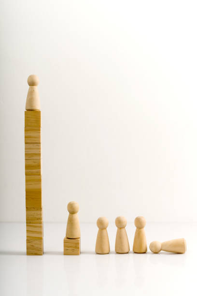 istock Wooden figures stand on the cubes that represent the stairs. 1284509773