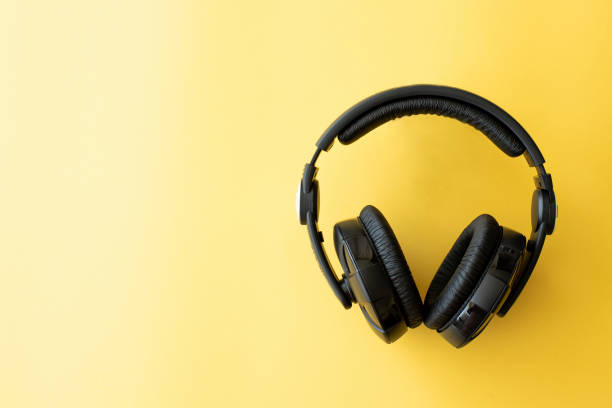 istock black headphones on yellow background 1284510554