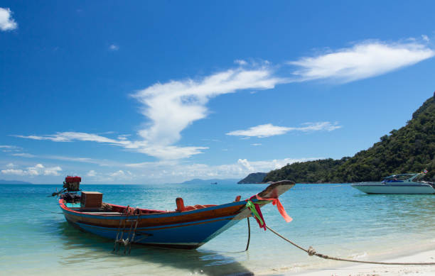 istock Long Tail Boat in Clear Water and Blue sky. Samui Island, Thailand. 1284510649