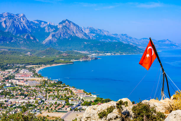 Aerial view of the Kemer town. Antalya province, Turkey. Turkish flag on foreground stock photo