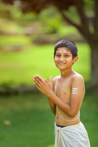istock A indian priest child with holy water pot 1284510782