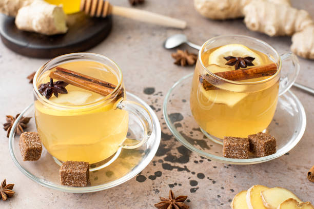 istock hot herbal tea with lemon, ginger and honey in glass mugs 1284510790
