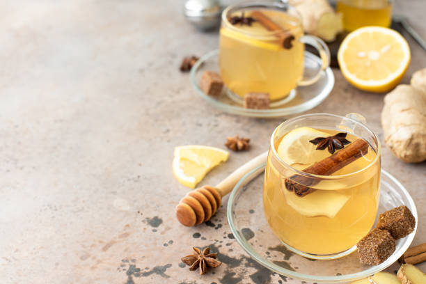 istock hot herbal tea with lemon, ginger and honey in glass mugs 1284510799