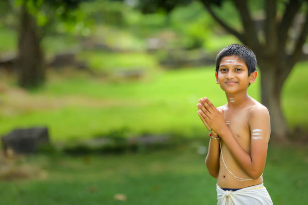istock the indian priest child doing meditation 1284511594