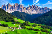 Santa Maddalena village, Dolomites mountains in background, Famous alpine place Santa Maddalena village, Val di Funes valley, Trentino Alto Adige region, Italy, Europe