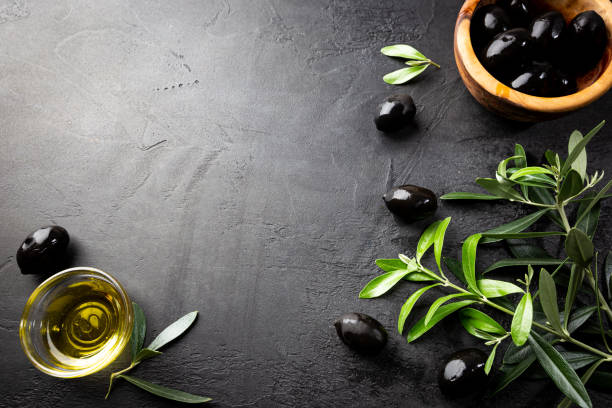 istock Black olives and olive oil 1284514340