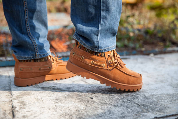 istock Human foot with leather shoes 1284515871