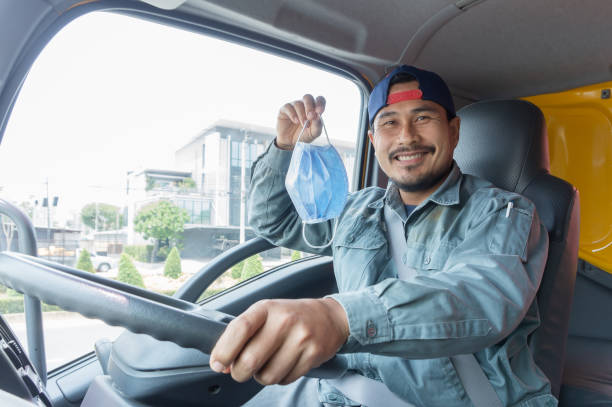 istock young Asian man professional driver driving a truck. 1284520199