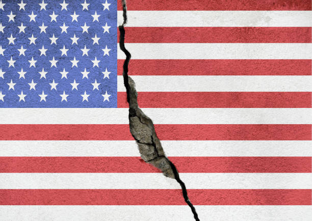 istock America divided concept, american flag on cracked background. US elections, polarization and division between republicans and democrats, rich and poor, educated and non educated people 1284522328