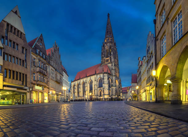 St Lambert's Church at dusk in Munster, Germany Munster, Germany. View of St Lambert's Church at dusk (HDR image) munster stock pictures, royalty-free photos & images