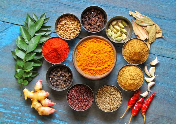 istock Curry powder with ingredients, common indian spices used in kitchen. Indian masala 1284522595