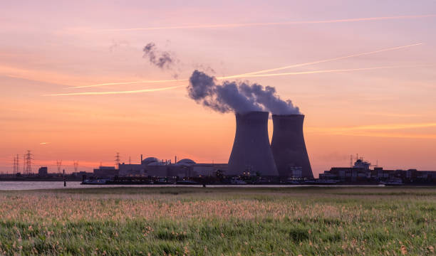Sunset over the nuclear reactor of Doel in the Port of Antwerp, Belgium. stock photo