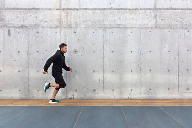 istock Young man running outdoors in morning 1284527016
