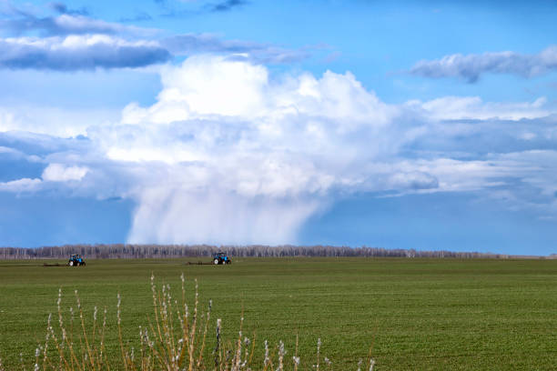 istock Horizontal panorama with a beautiful thundercloud in an open space in the field. 1284527856