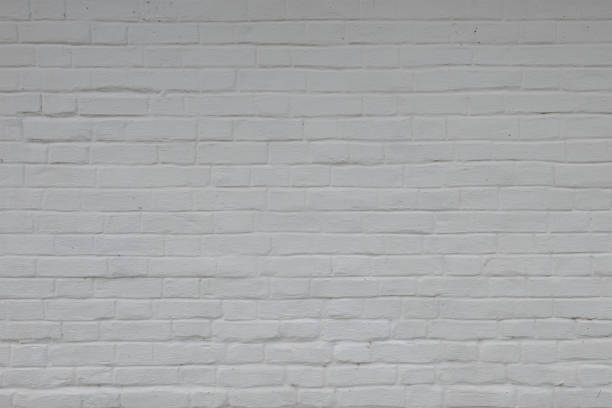 istock Old brick wall painted white photographed horizontally 1284528201