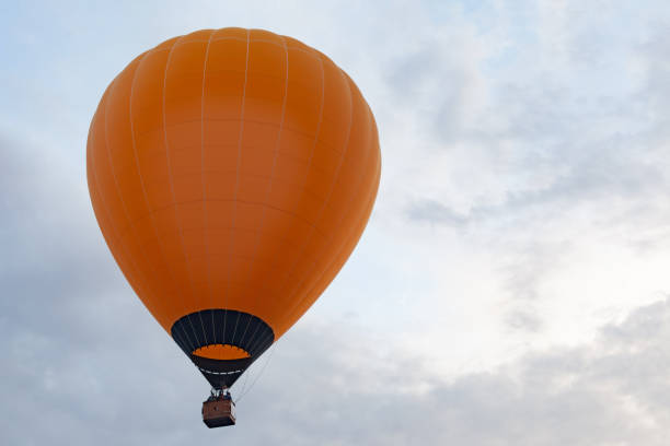 istock orange aerostat in overcast sky 1284529130