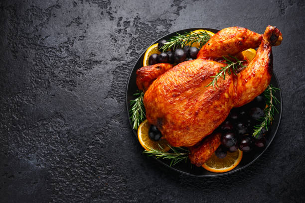 istock Roast Chicken in oven with on black rustic table 1284529133