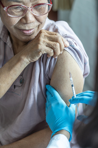 Vaccine shot for elderly people vaccination, medical immunization for aging woman or older patient, geriatric treatment from disease such as coronavirus, covid-19, Influenza , pneumococcal, or hepatitis B