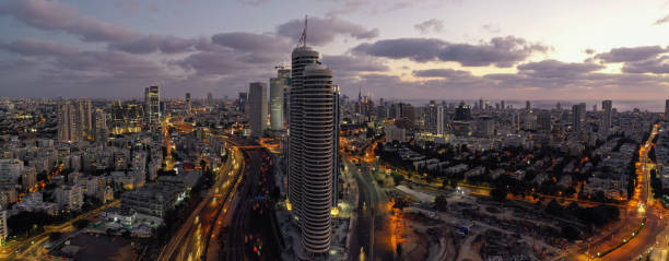 istock Modern office building downtown cityscape skyscraper skyline aerial view night 1284529870