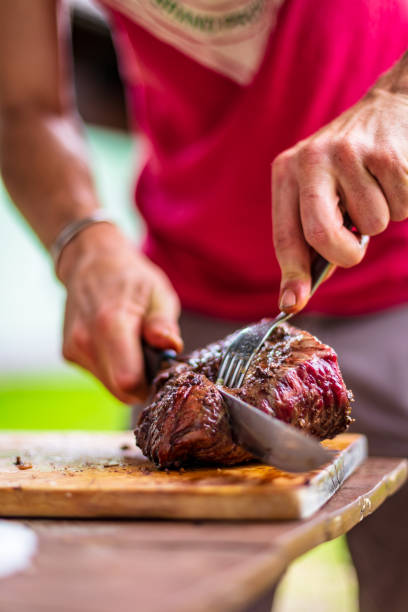 istock barbeque meat preparation in a summer day 1284530249