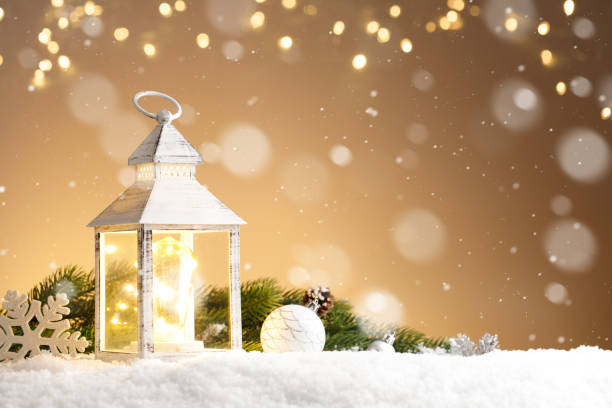 Burning lantern and christmas decoration on gold background with lights Burning lantern and christmas decoration on gold background with lights, copy space lantern photos stock pictures, royalty-free photos & images