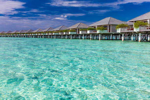 istock Beautiful summer beach paradise with sandy beach and villas 1284532671