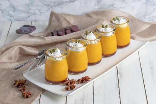 Baked Pumpkin pudding on a wood background.selective focus
