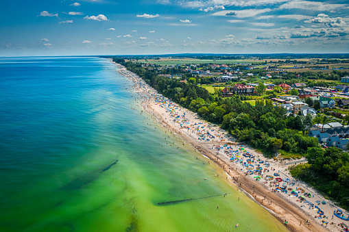 Beach with people on Baltic Sea, aerial view of Poland