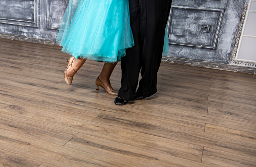 Ballroom dance couple of dancers and teachers in studio school dancing in rehearsal.