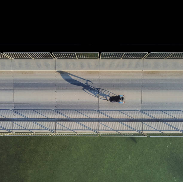 istock one cyclist on the bridge view from above 1284537498