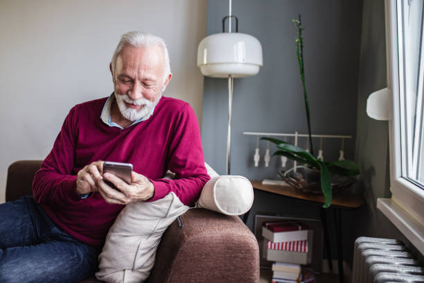 istock A portrait of a senior man using mobile phone at home 1284540081