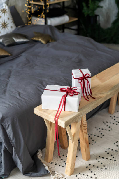 istock Present box on wooden bench in bedroom 1284540675