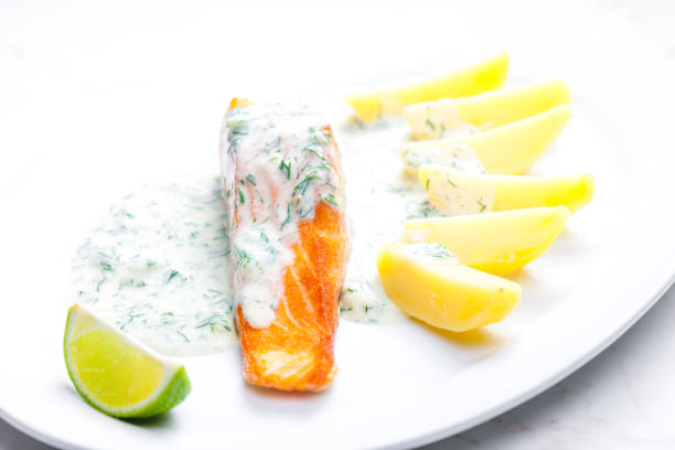istock baked salmon with creamy dill sauce and potatoes 1284540834