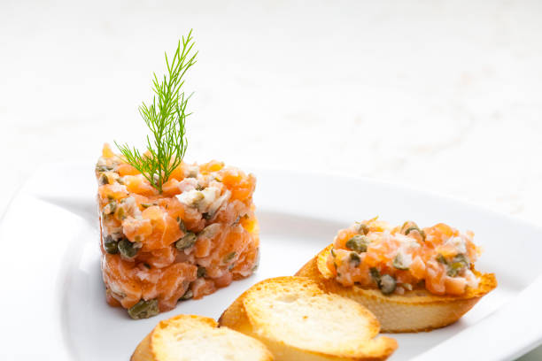 istock salmon tartare with toasted baguette 1284541411