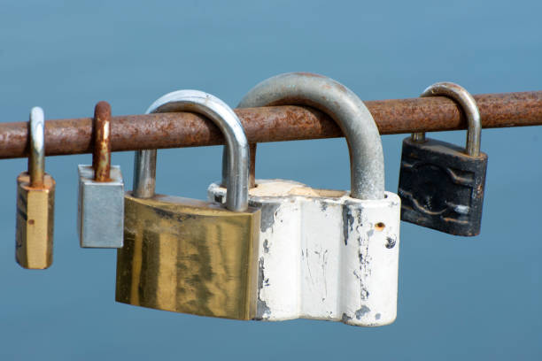 istock Old rusty locks are hangs on the bridge. The tradition of locking padlocks on a bridge for a long married life. 1284542061