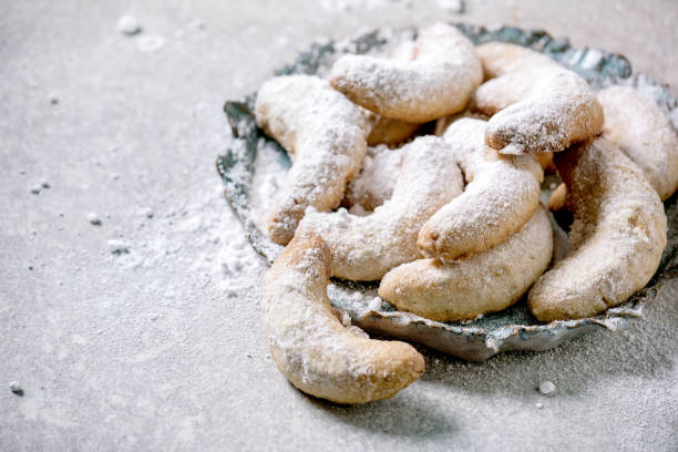 istock Christmas shortcrust cookies vanilla crescents with icing sugar 1284543461