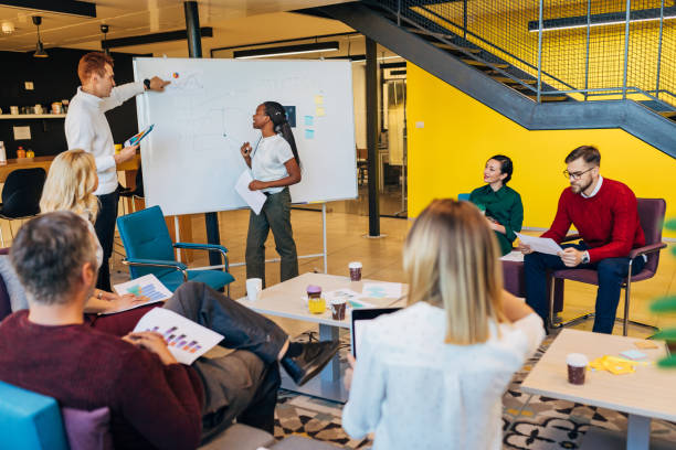 istock Redhead businessman coach give business presentation conducting conference training 1284543483