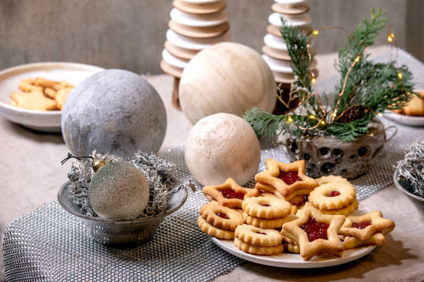 istock Christmas Linz shortbread biscuits cookies with wooden decorations on xmas table 1284543508