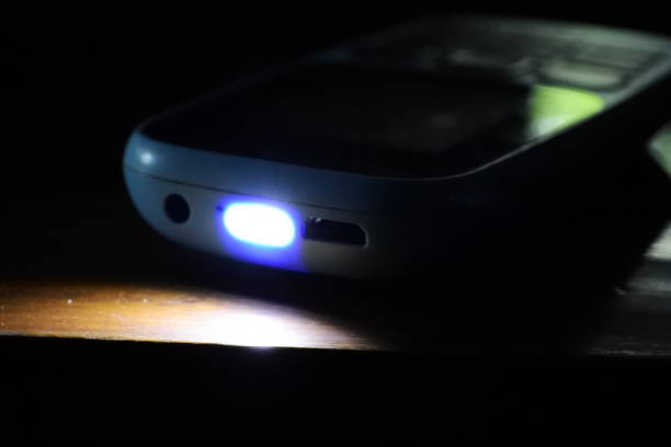 istock Selective focus shot of a bright flashlight on a mobile phone 1284543860