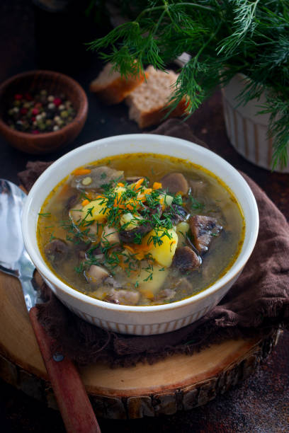 istock Homemade soup with wild mushrooms and red lentils, selective focus 1284544927
