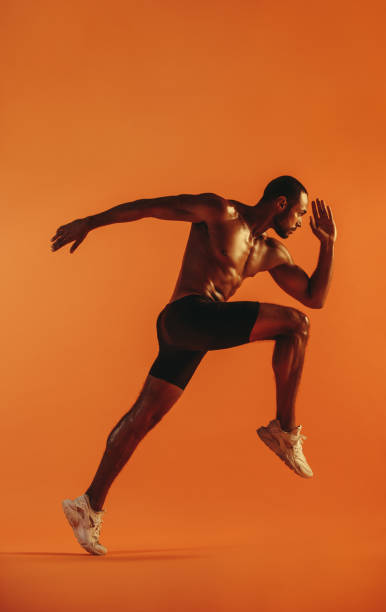 istock Side view of male athlete running 1284544971